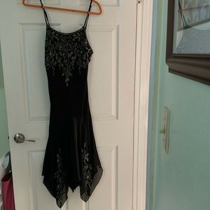 Sexy and flirty black spaghetti strap dress by JKARA,  size 10